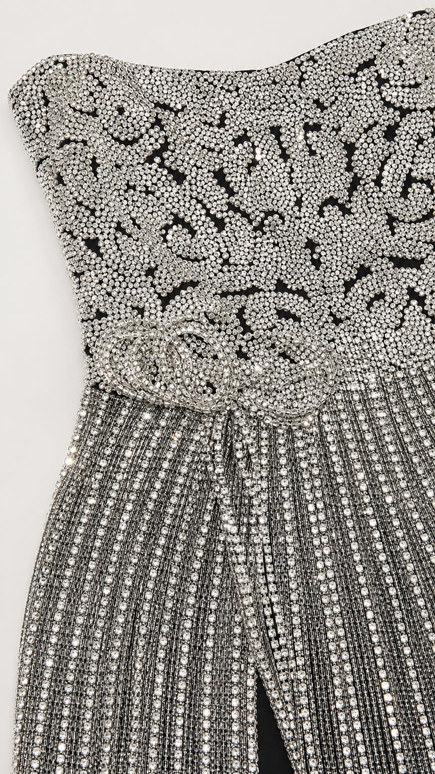 Close-up detail of the intricate bodice beadwork and rhinestone patterns