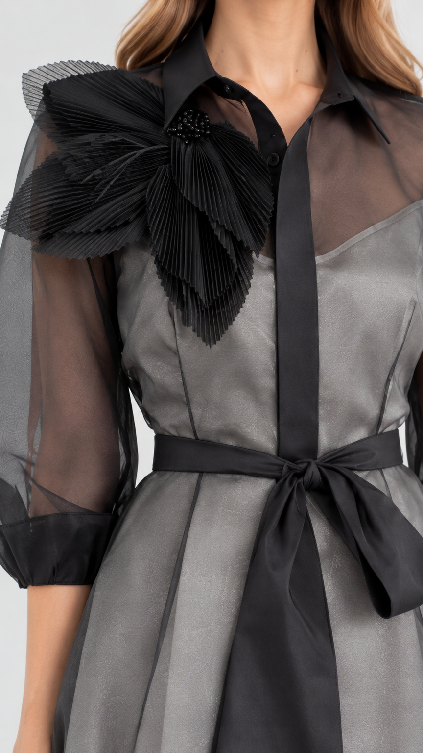Close-up detail of the collar, pleated 3D shoulder bloom, and tie sash on Charcoal Grey dress