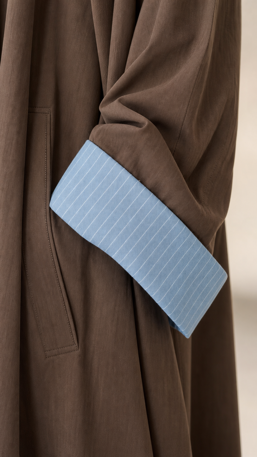 Close-up detail of Mocha Brown sleeve cuff with light blue pinstripe lining