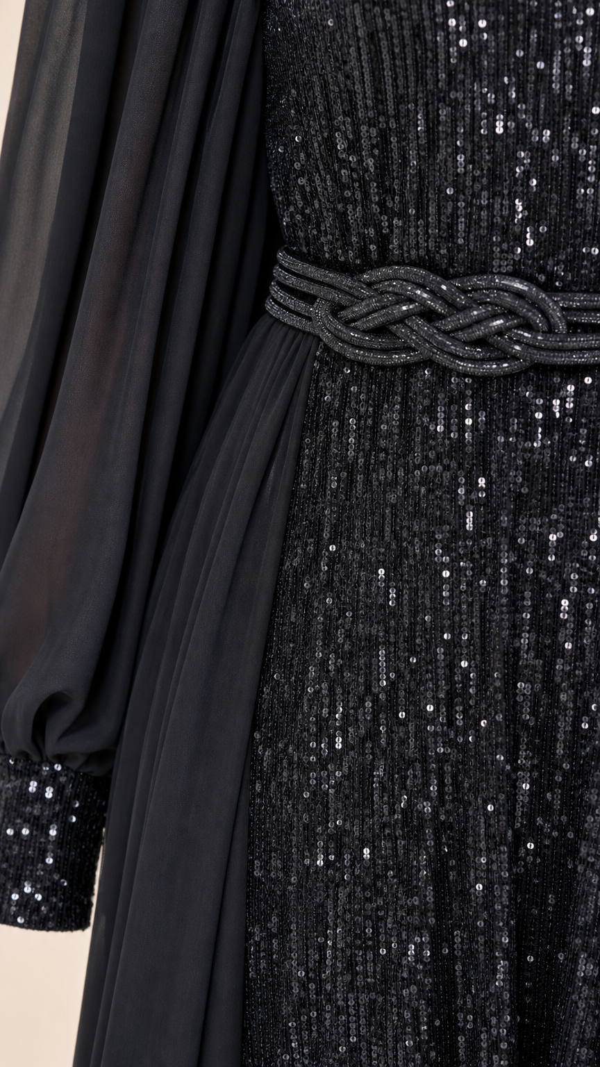 Close-up of black sequin texture, braided waistline detail, and sheer chiffon sleeve