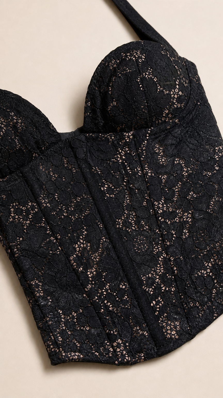 Close-up detail of Black lace corset bodice with sweetheart neckline and boning