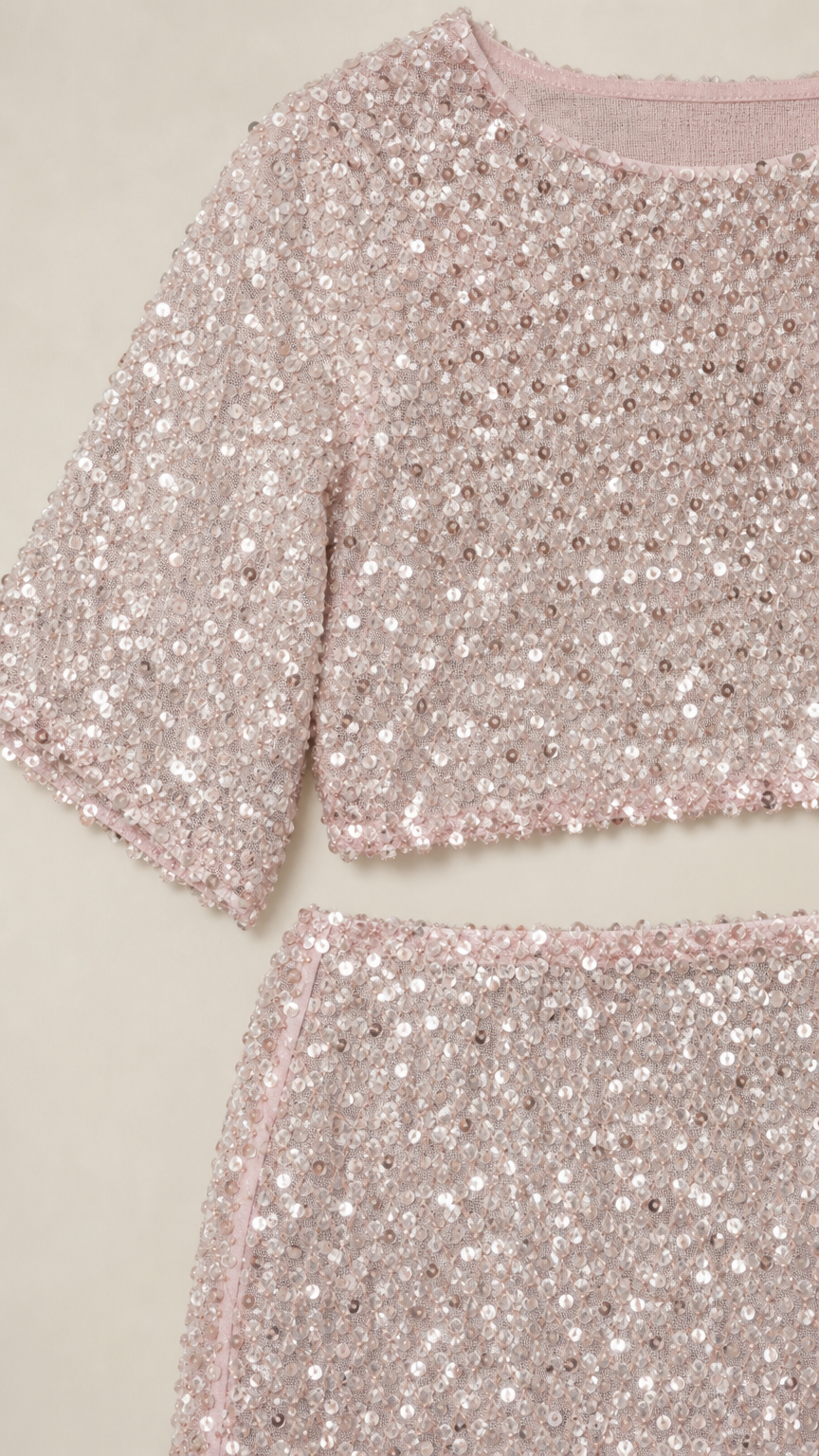 Close-up detail of blush pink sequin mesh fabric and neckline