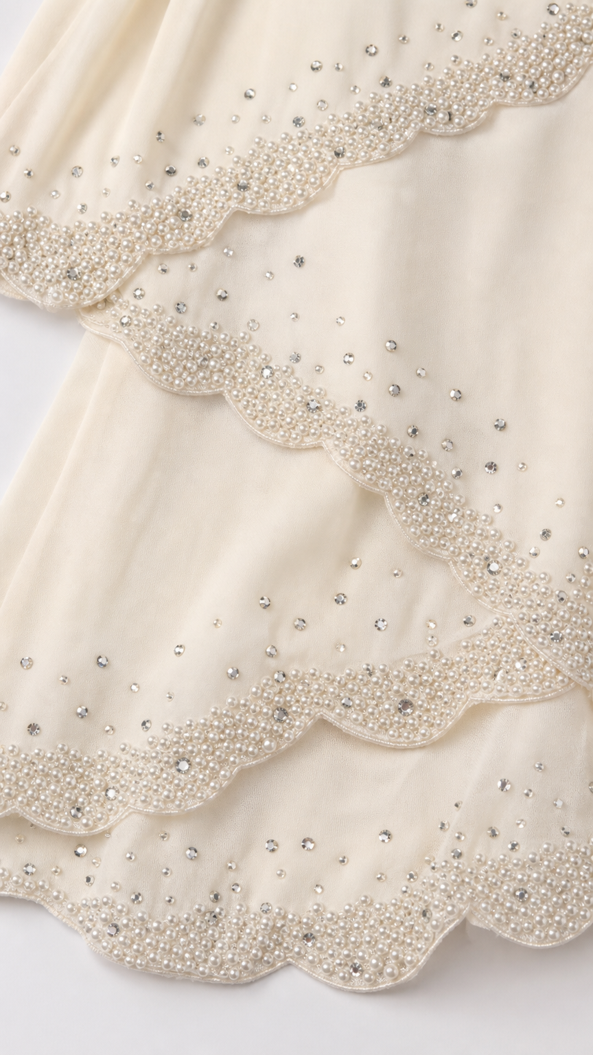 Close up detail of beaded scalloped tiers
