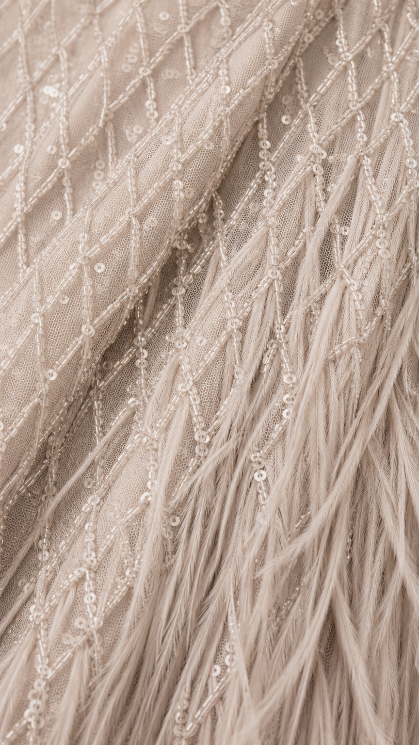 Close-up detail of sequin embroidery and feather texture