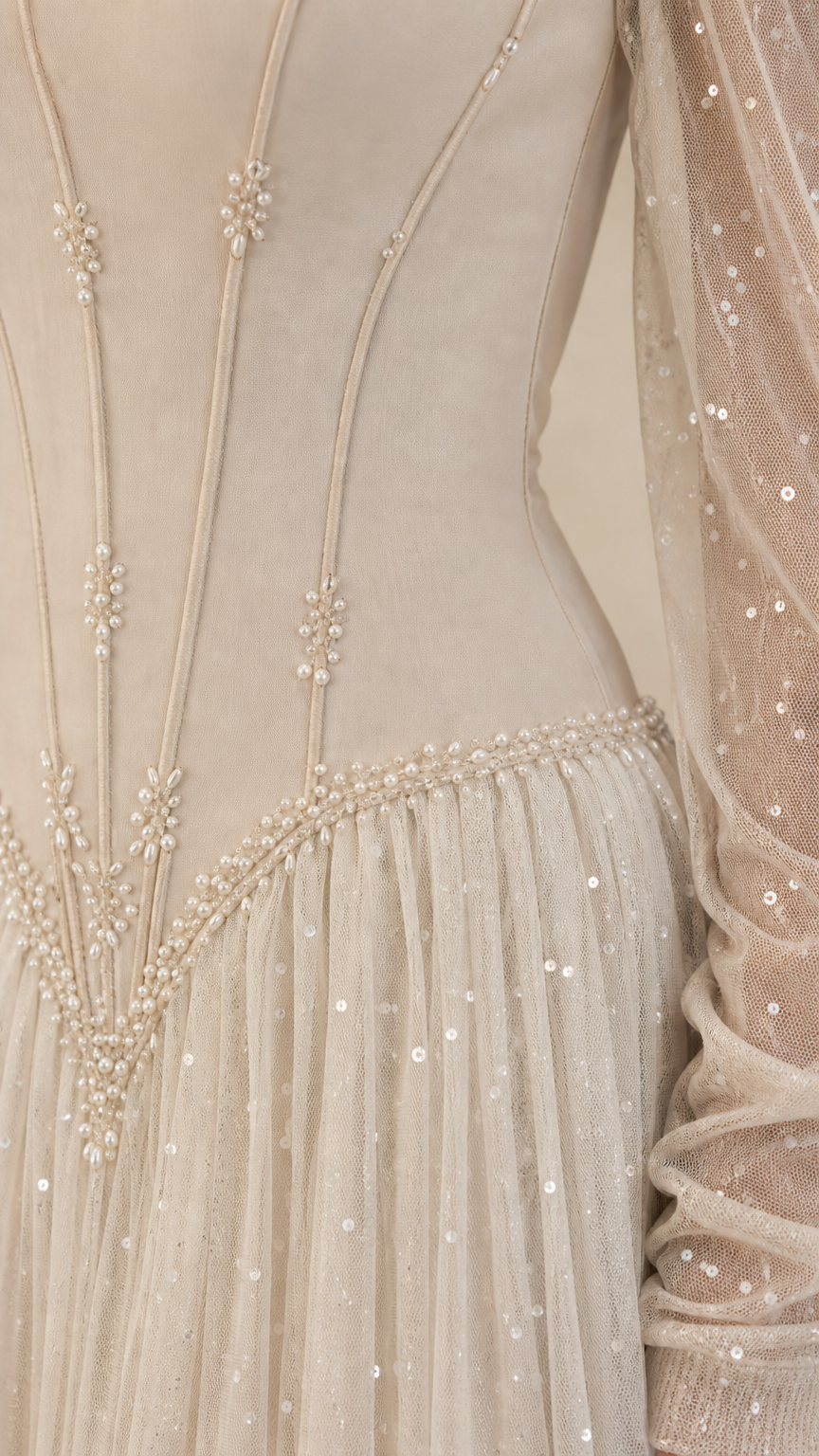 Close-up of structured corset bodice with boning lines and pearl beaded basque waist trim