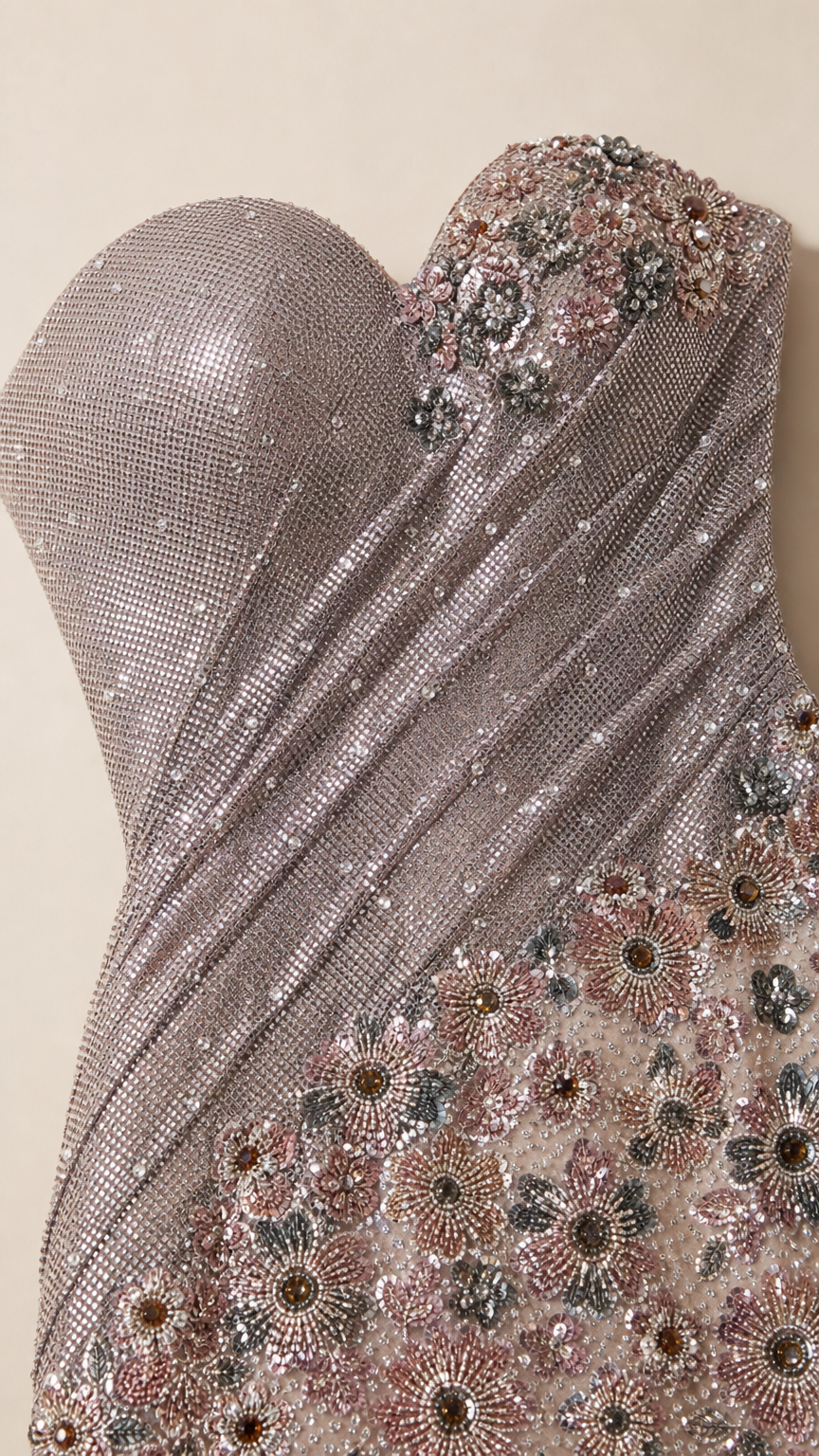 Close-up of floral embellishment and shimmering fabric texture