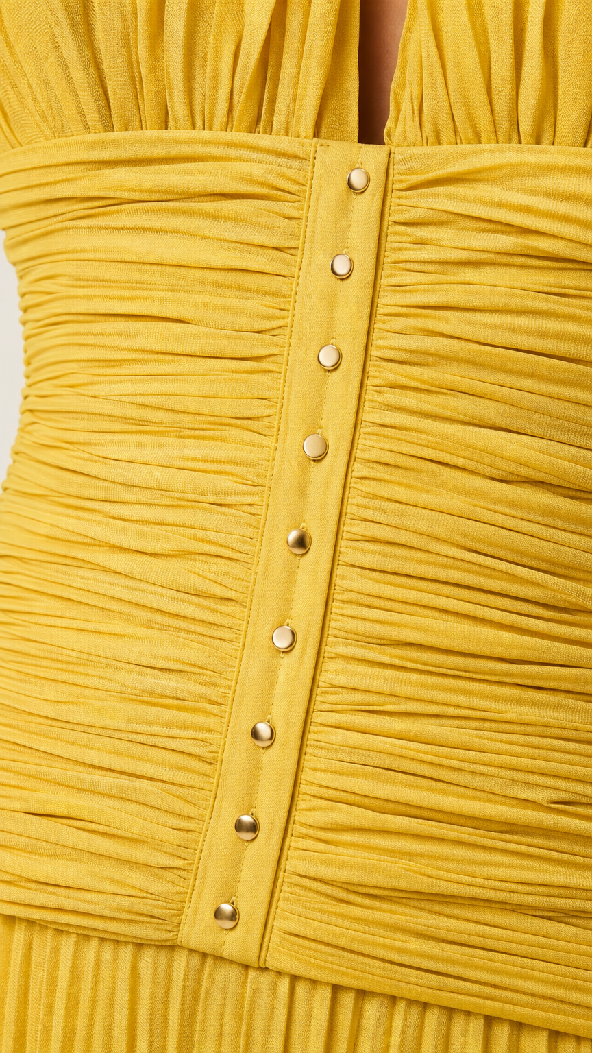 Close-up of ruched bodice and button details on yellow dress