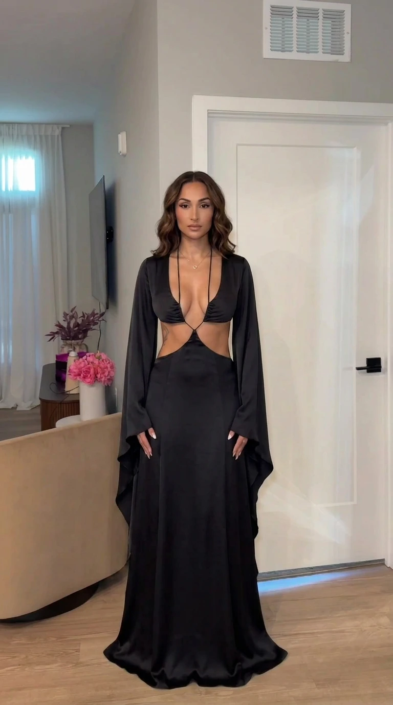 Front view of model wearing black cutout maxi dress