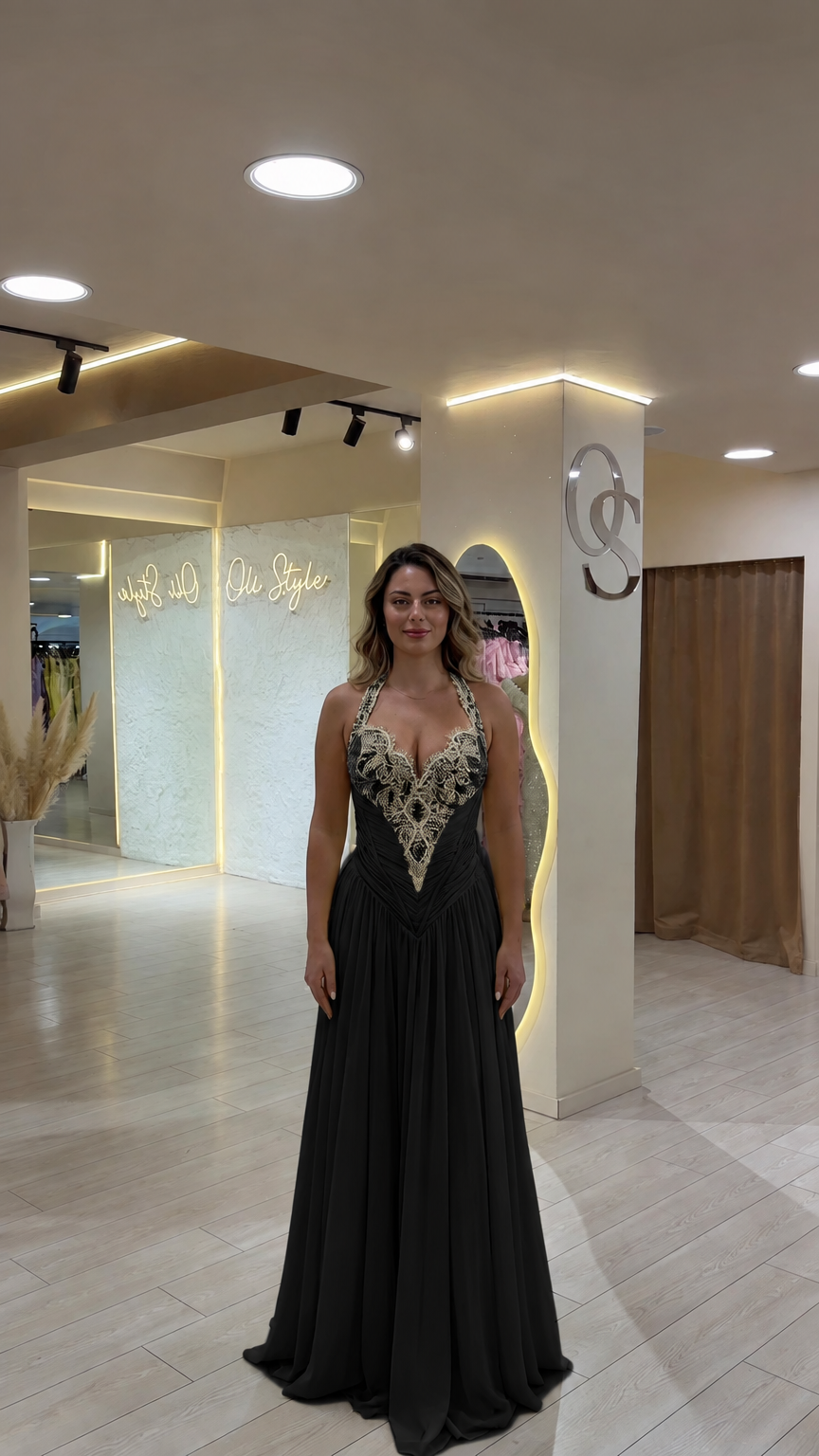 Model wearing classic black beaded halter neckline evening gown