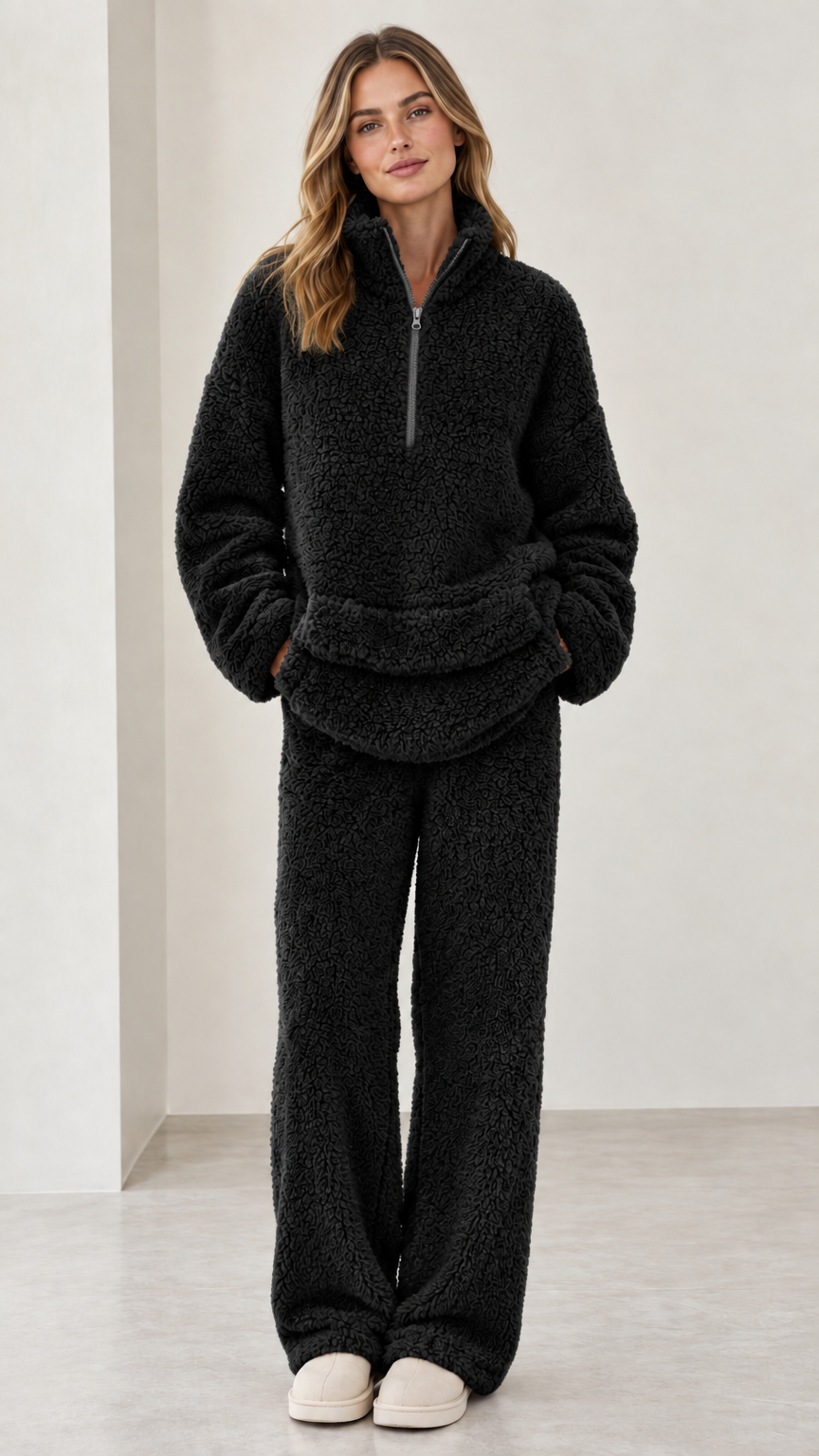 Model wearing black sherpa fleece quarter-zip two-piece lounge set
