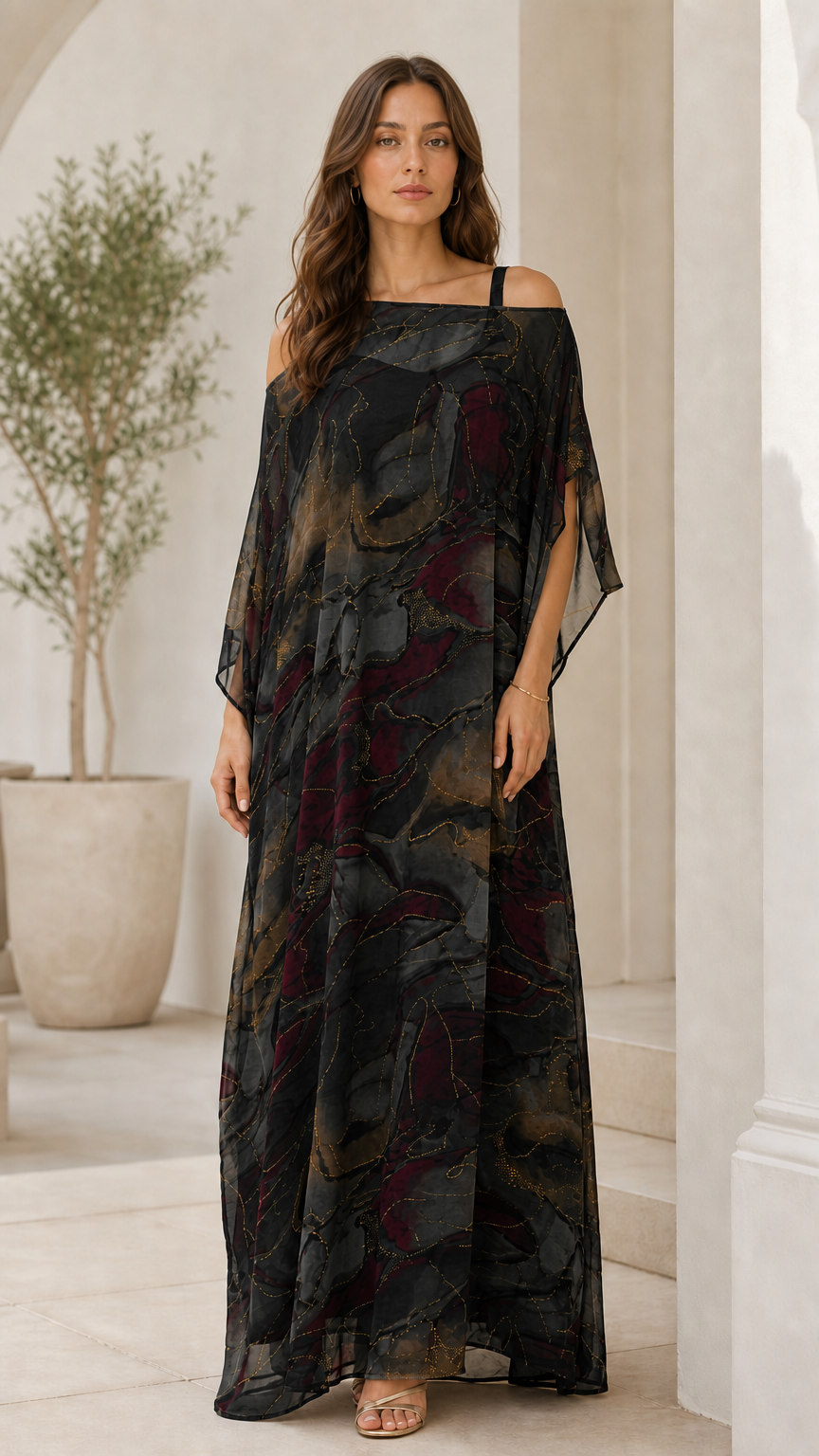 Woman wearing black abstract watercolor print cold-shoulder maxi dress