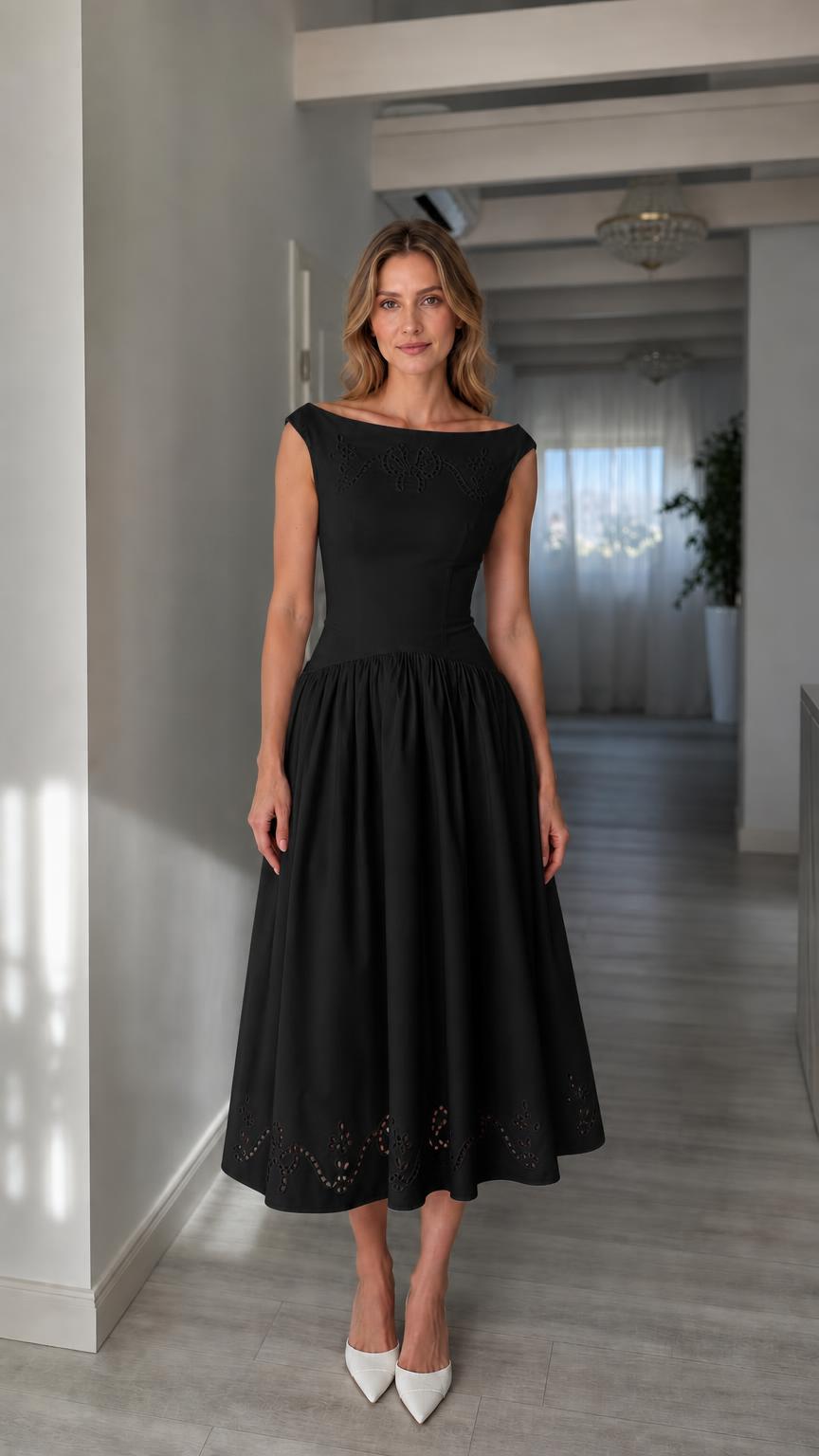 Full view of woman wearing black boatneck midi dress