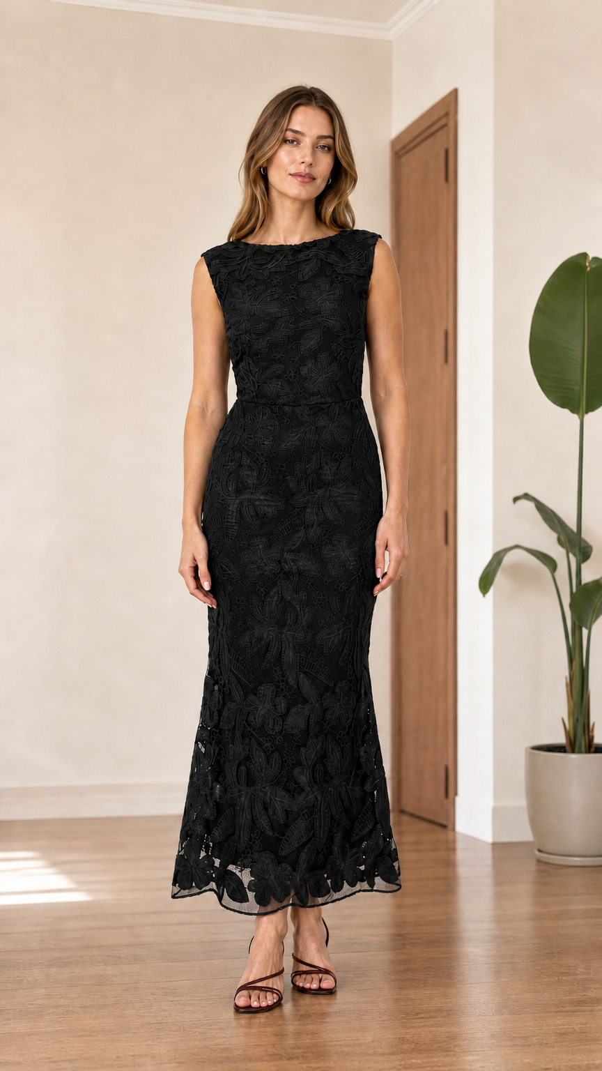 Front view of black sleeveless floral lace mermaid maxi dress