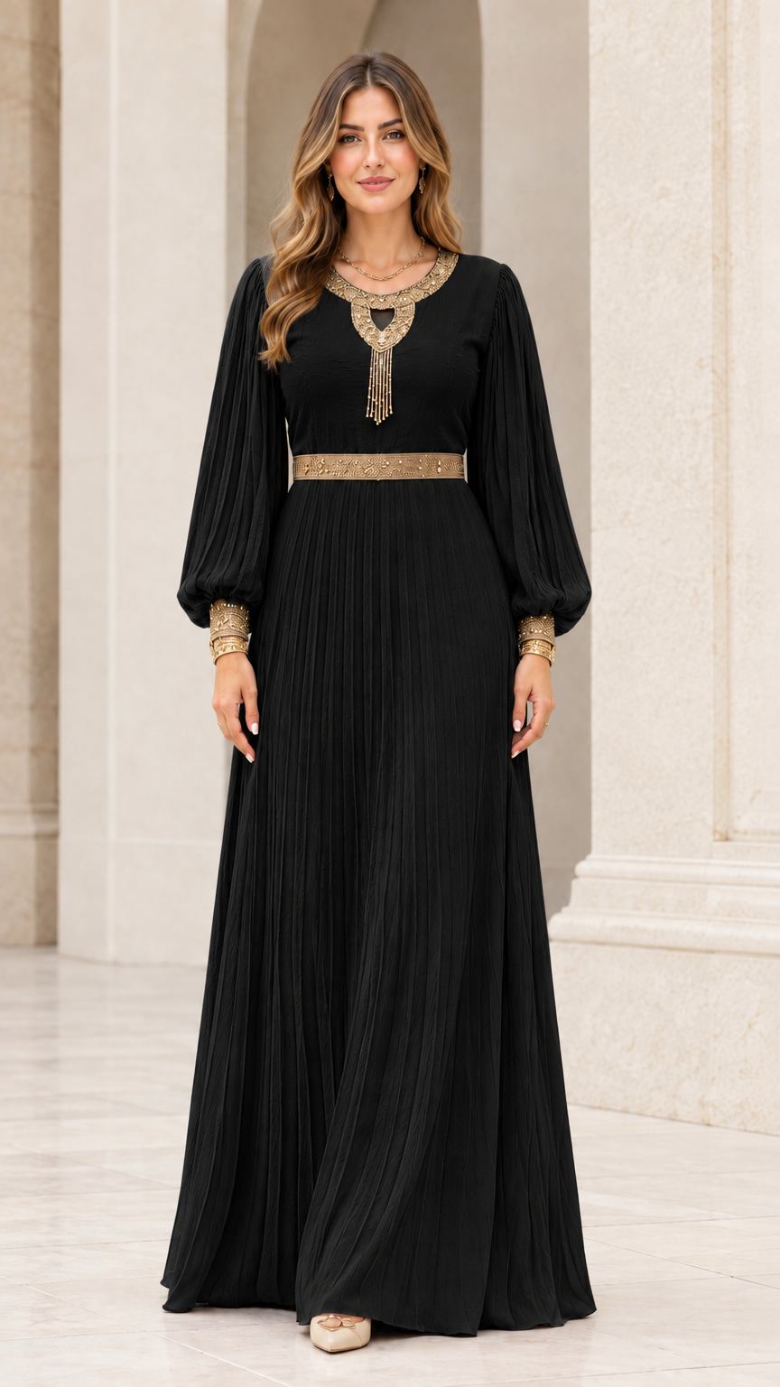 Front view of black pleated long sleeve maxi dress with gold embroidered accents