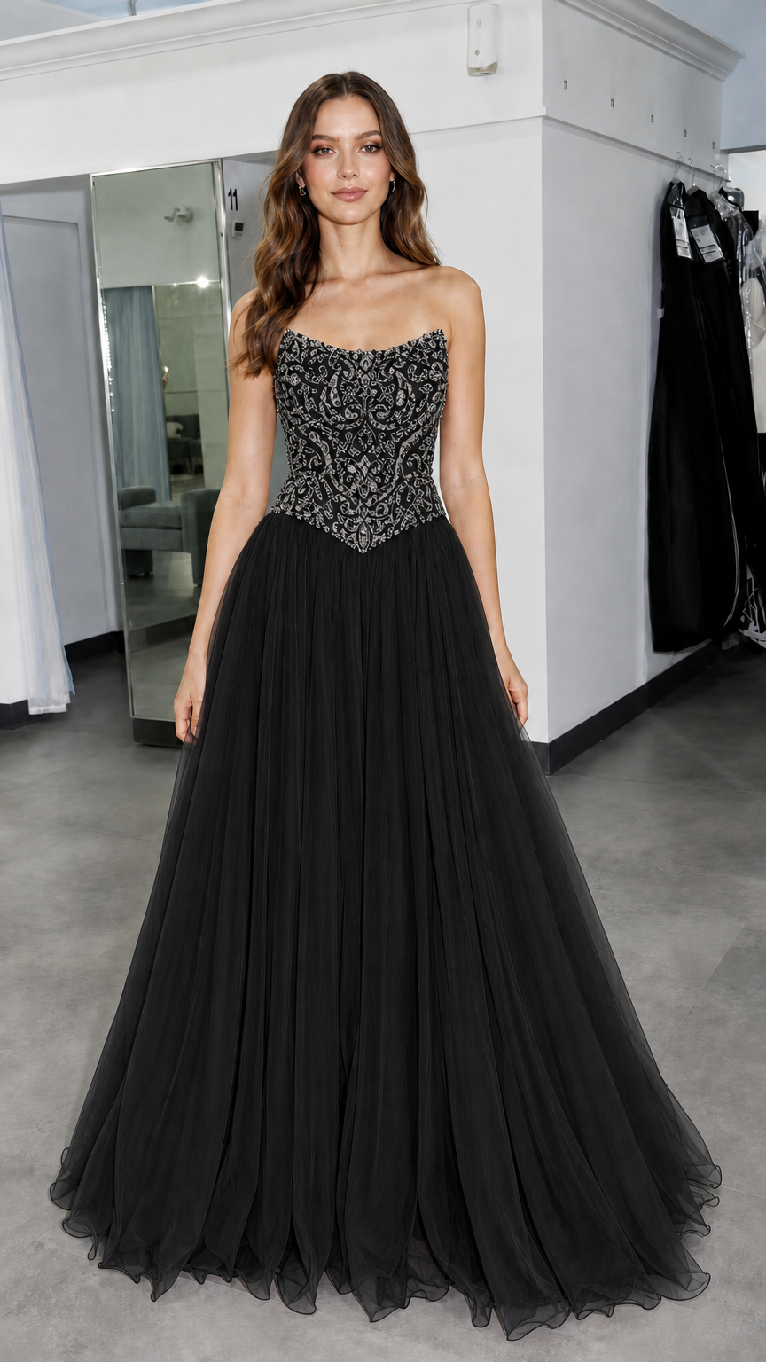 Front view of model wearing black beaded evening gown