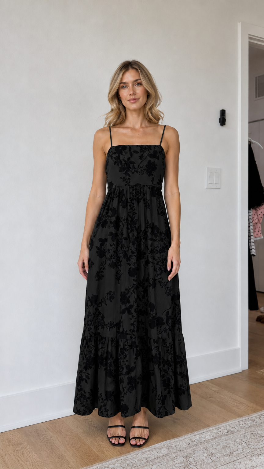Model wearing black floral maxi dress
