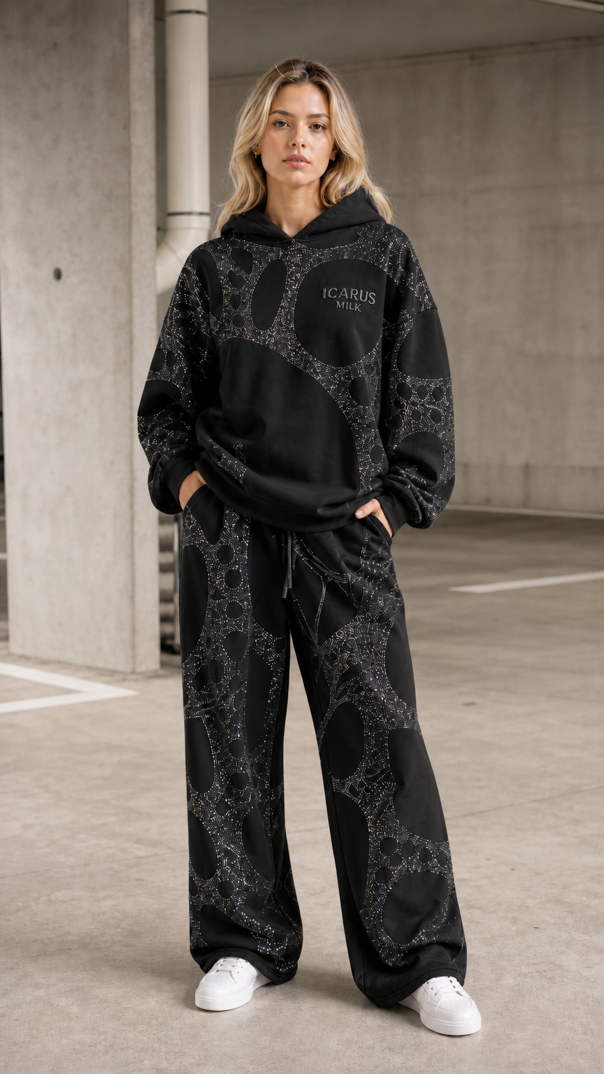 Front view of model wearing black rhinestone hoodie and pants set