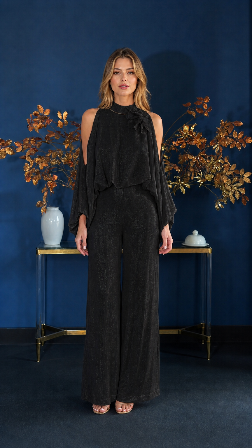 Front view of model wearing black cold-shoulder jumpsuit