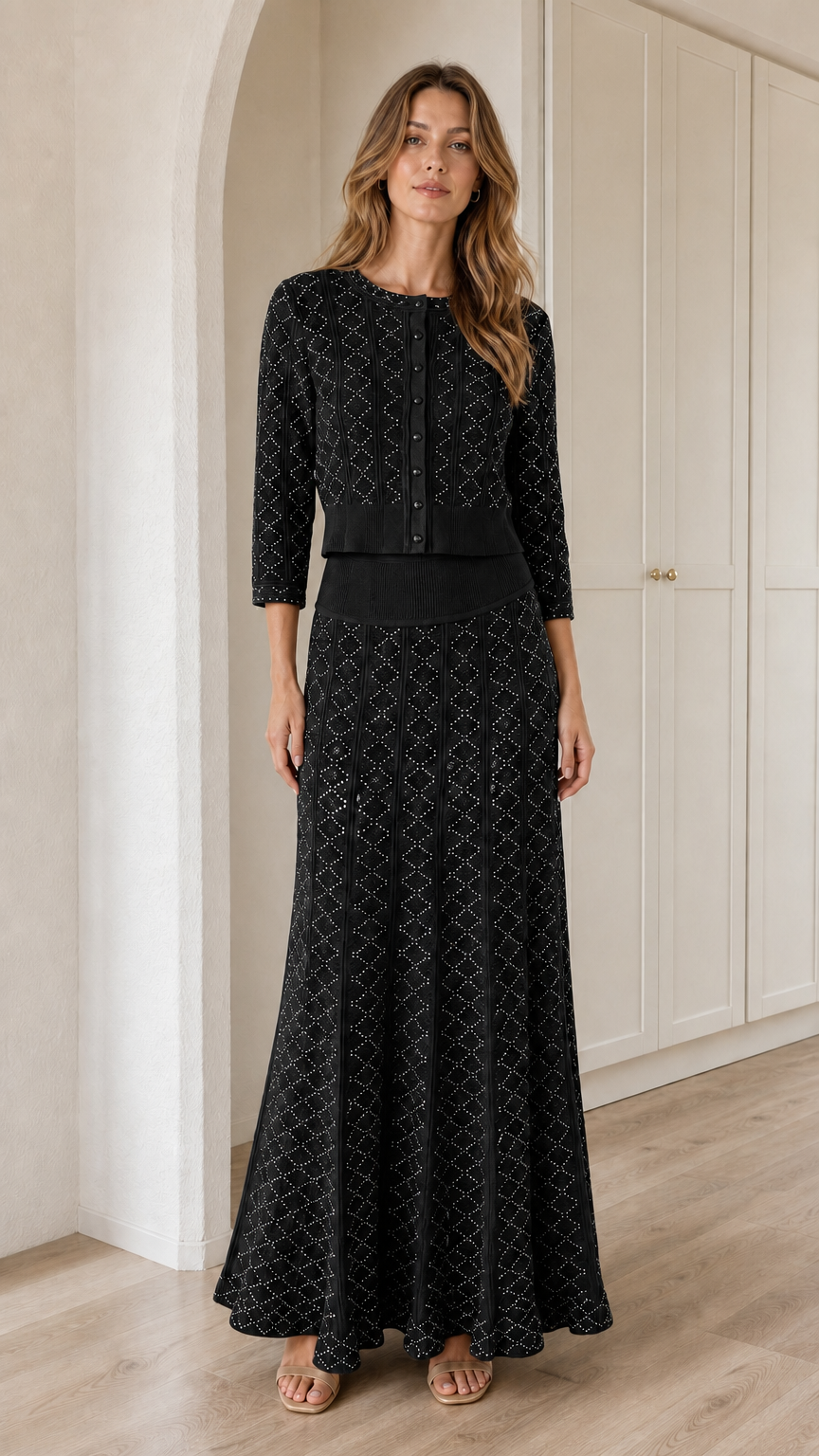 Model wearing Black pointelle knit cardigan and maxi skirt two-piece set