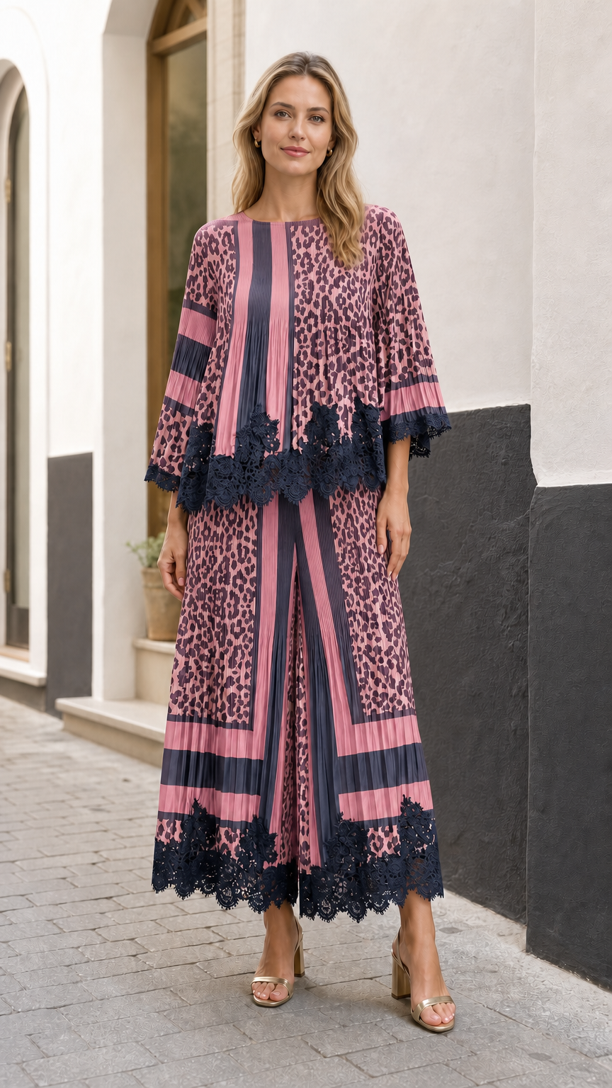Full front view of model wearing the mauve pink and navy pleated leopard two-piece set