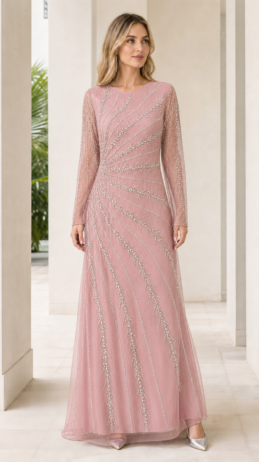 Woman wearing dusty pink embellished long sleeve formal gown