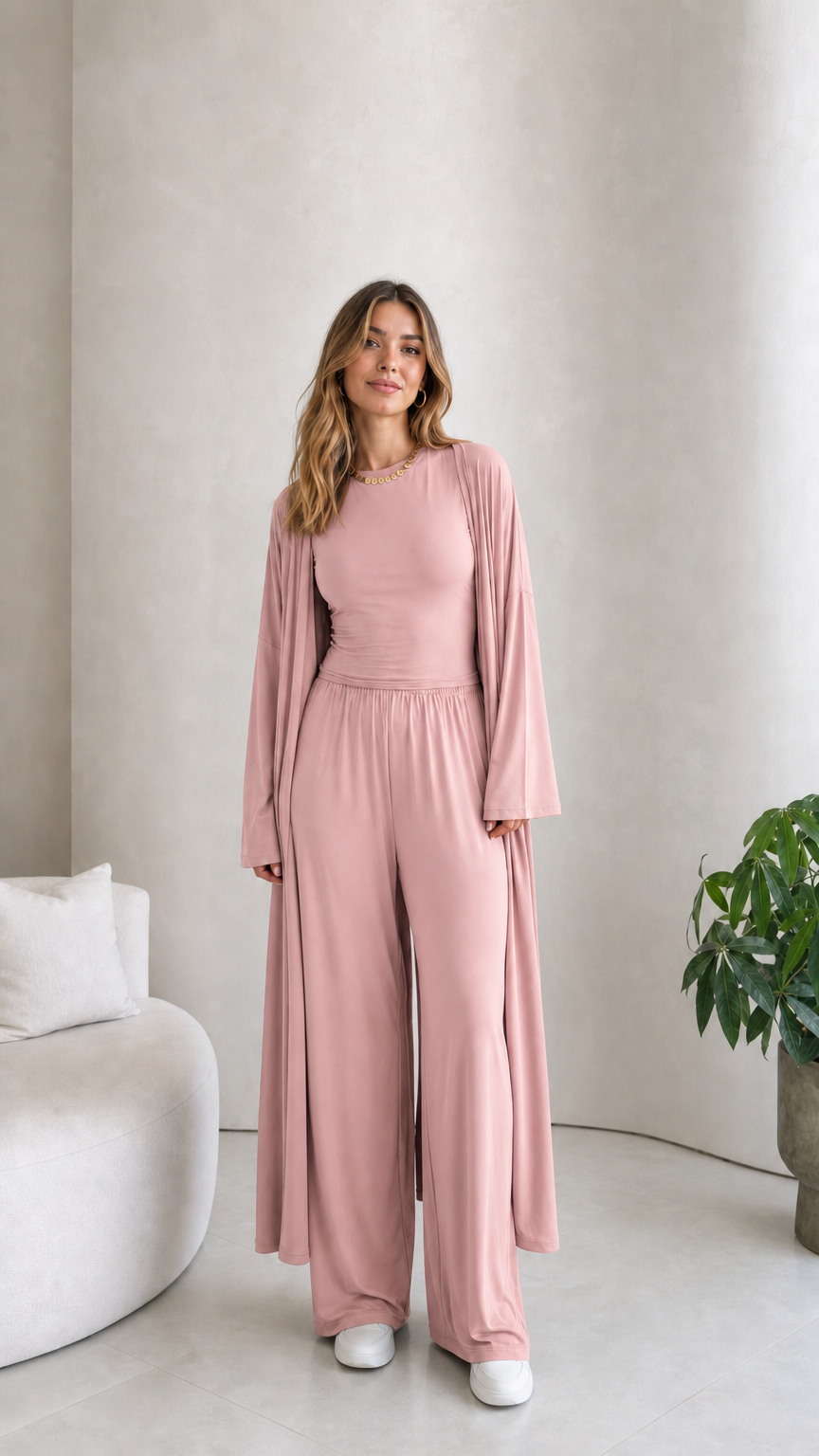 Front view of model wearing the 3-piece duster cardigan and pants set in dusty pink