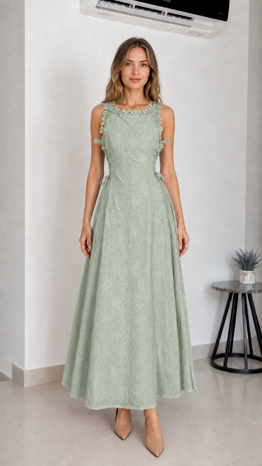 Model wearing sage green embroidered eyelet maxi dress