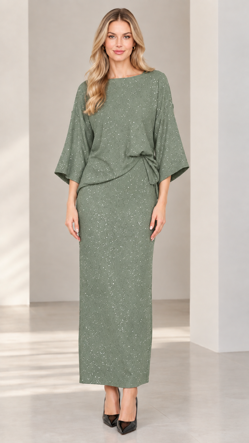Full-length studio shot of woman modeling sage green glitter two-piece maxi skirt set