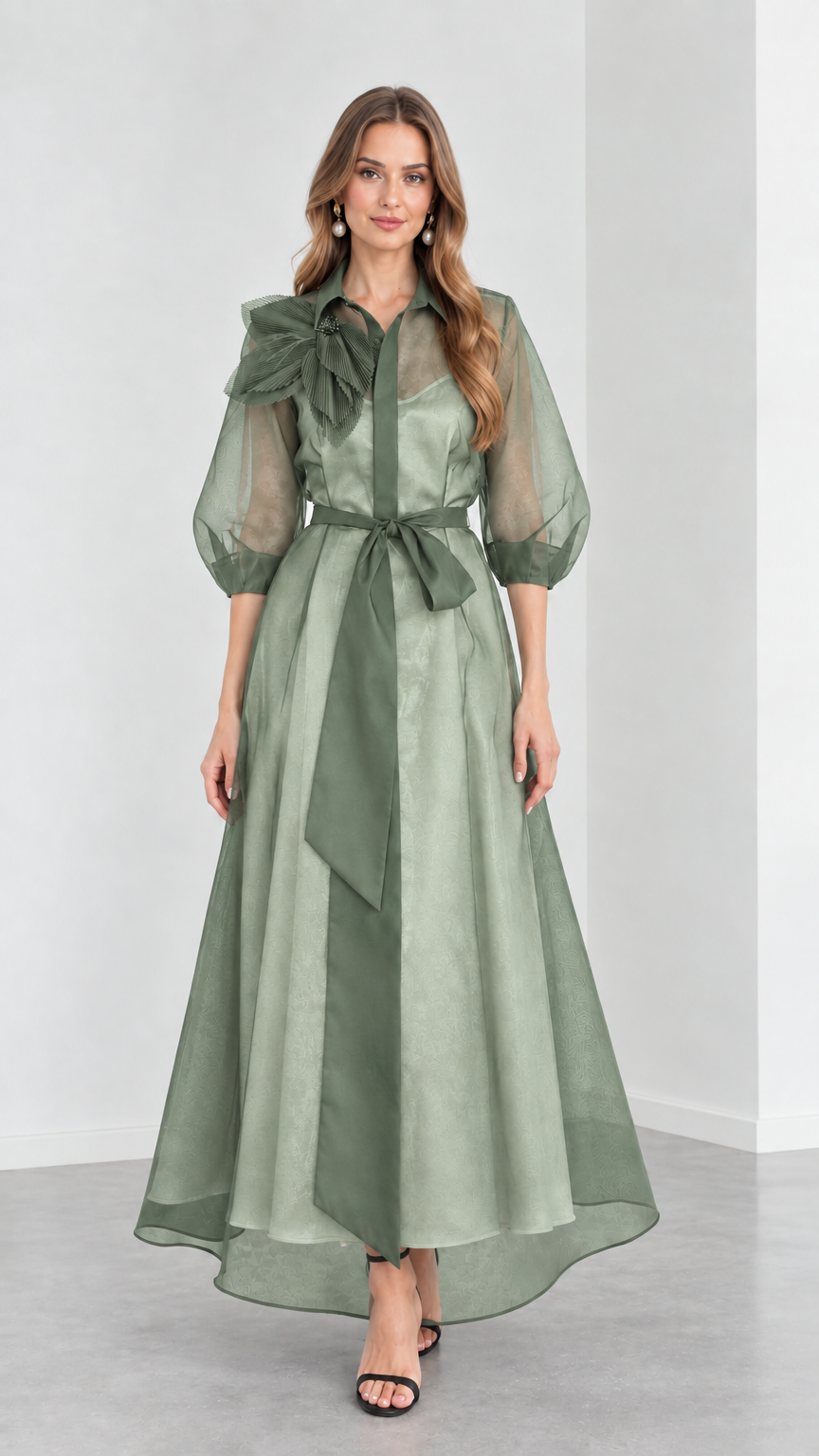 Front view of model wearing monochromatic Sage Green organza collared maxi gown with tie sash