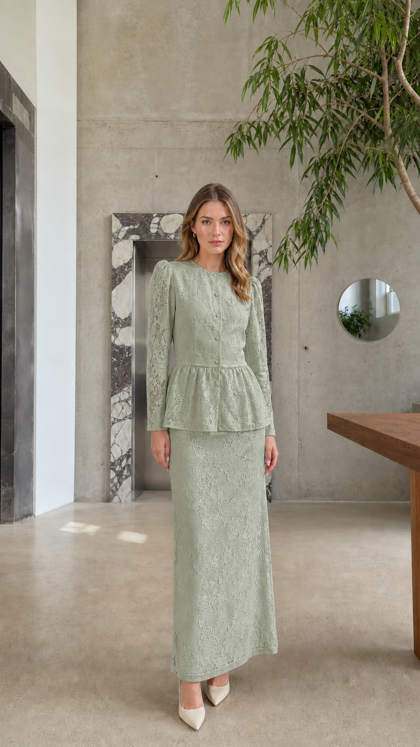 Full length view of model wearing the Sage Green floral lace peplum top and maxi skirt set