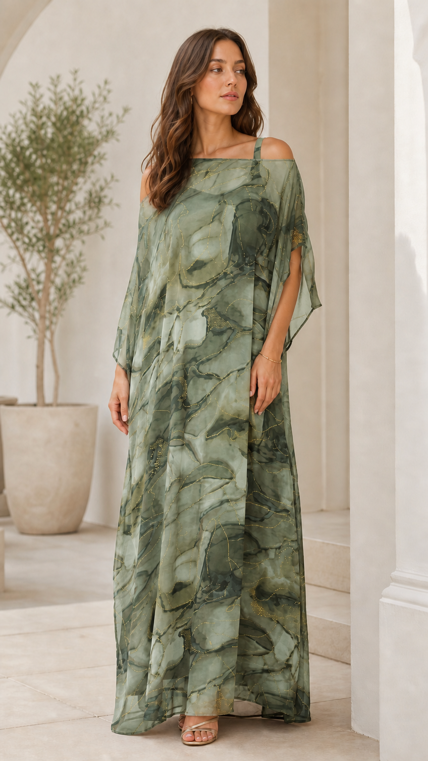 Woman wearing sage green artistic print cold-shoulder draped maxi dress