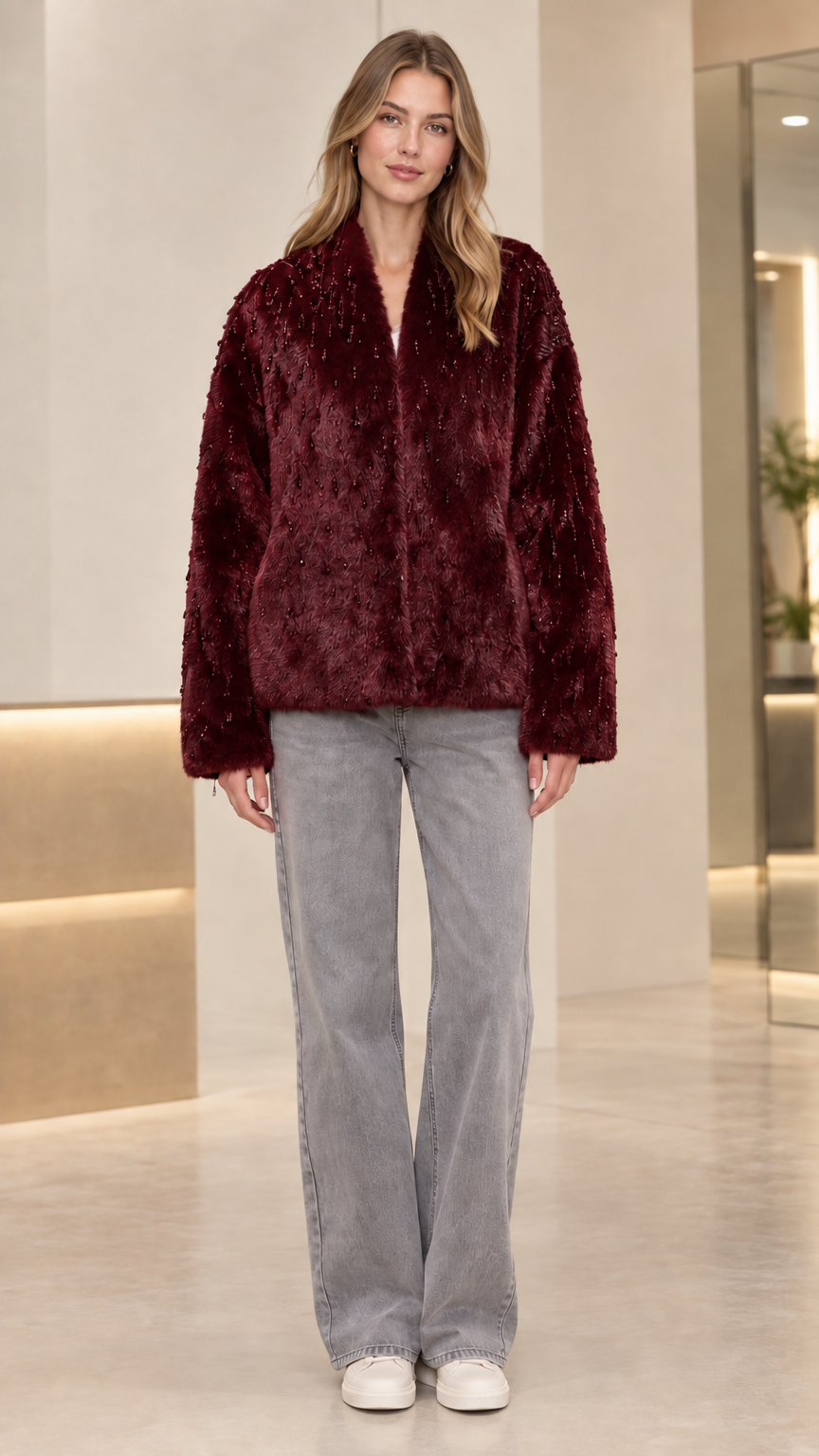Front view of model wearing burgundy wine beaded faux fur jacket