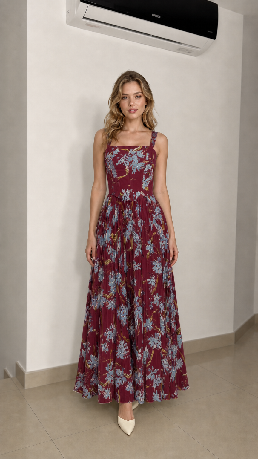 Model wearing burgundy floral maxi dress