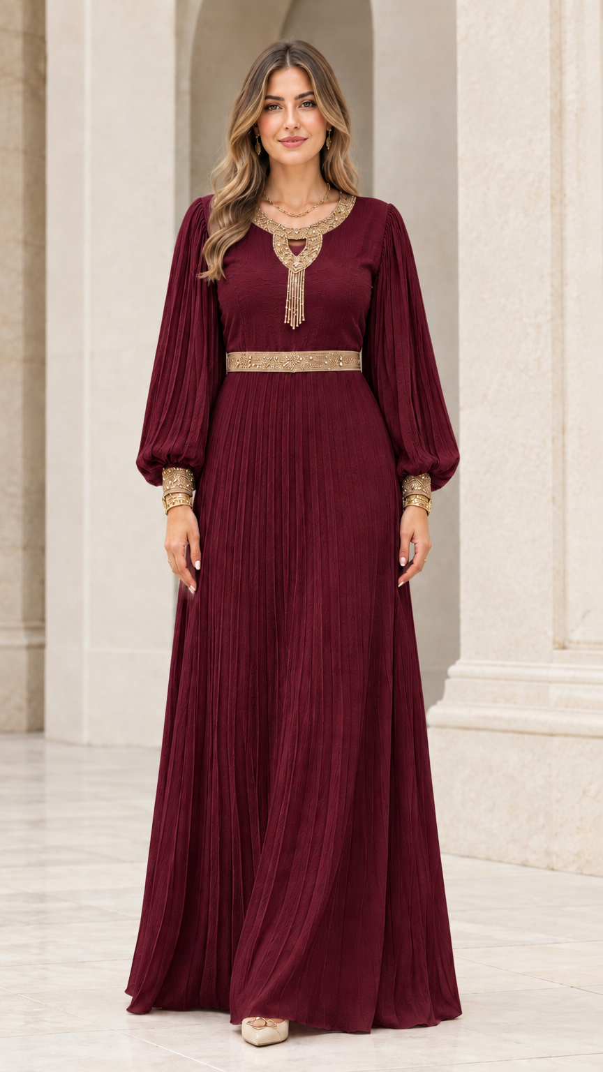 Front view of rich burgundy wine pleated maxi dress with gold embroidery