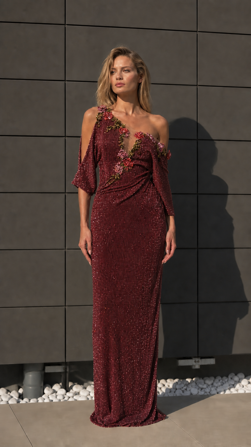 Front view of burgundy one-shoulder beaded evening dress