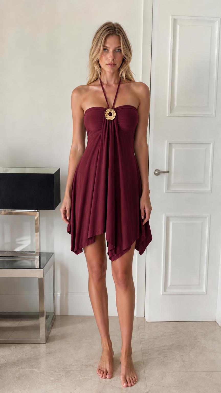Front view of model wearing burgundy halter mini dress