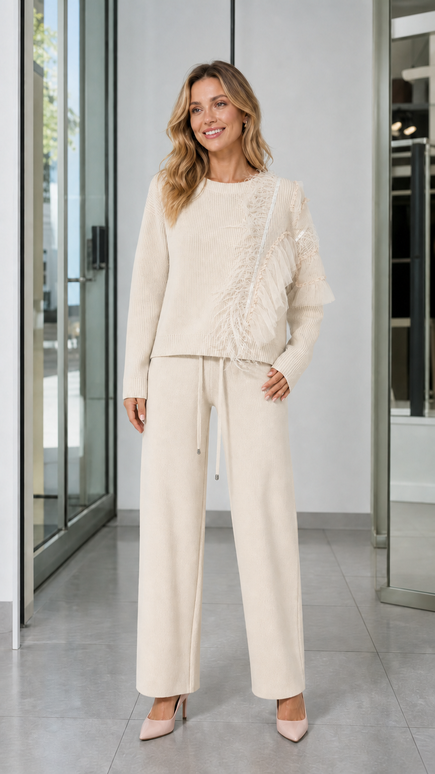 Full-length front view of woman wearing Cream knit sweater and wide-leg pants set