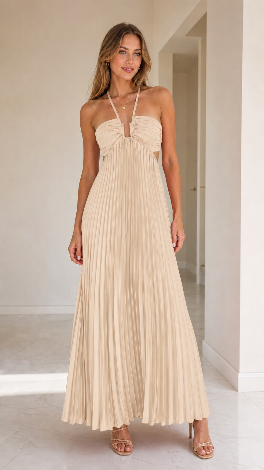 Model wearing beige halter pleated maxi dress