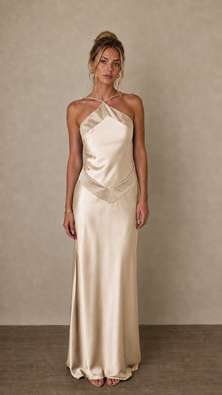Front view of champagne satin halter maxi dress on model
