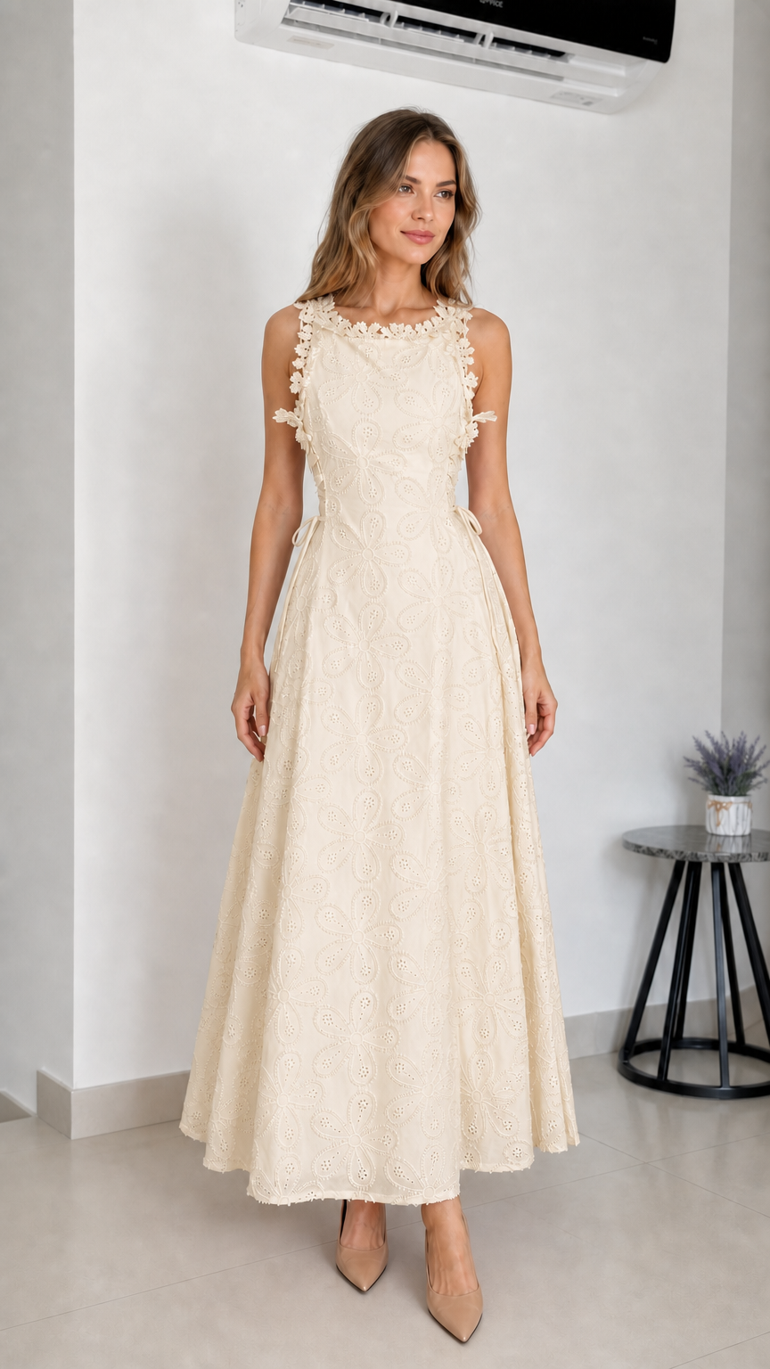 Model wearing beige embroidered eyelet maxi dress