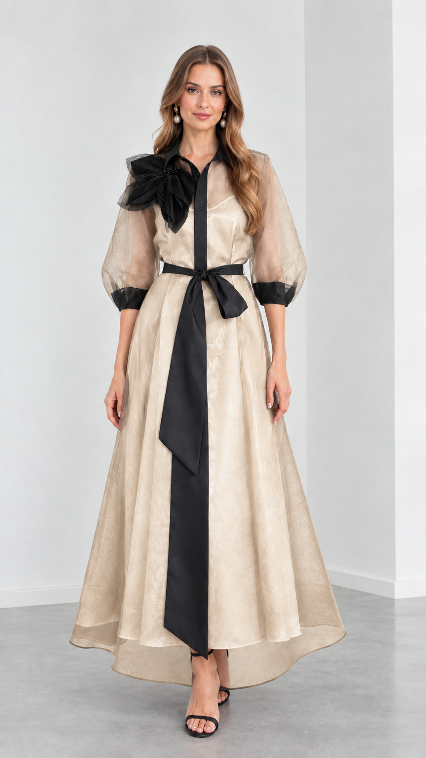 Front view of model wearing Champagne beige organza evening shirt dress with black sash