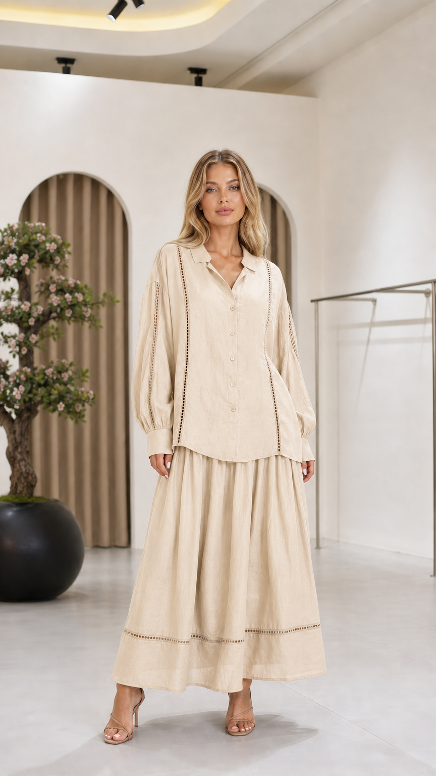 Front view of the cream women's blouse and maxi skirt two-piece set