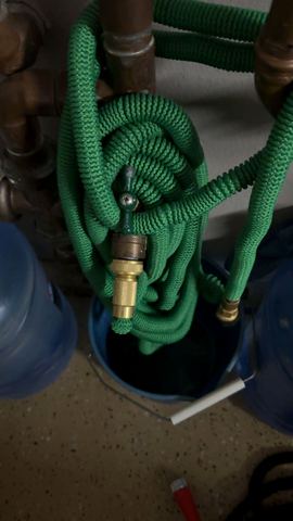 Customer photo for 100FT Heavy Duty Expandable Garden Water Hose 4-Pack
