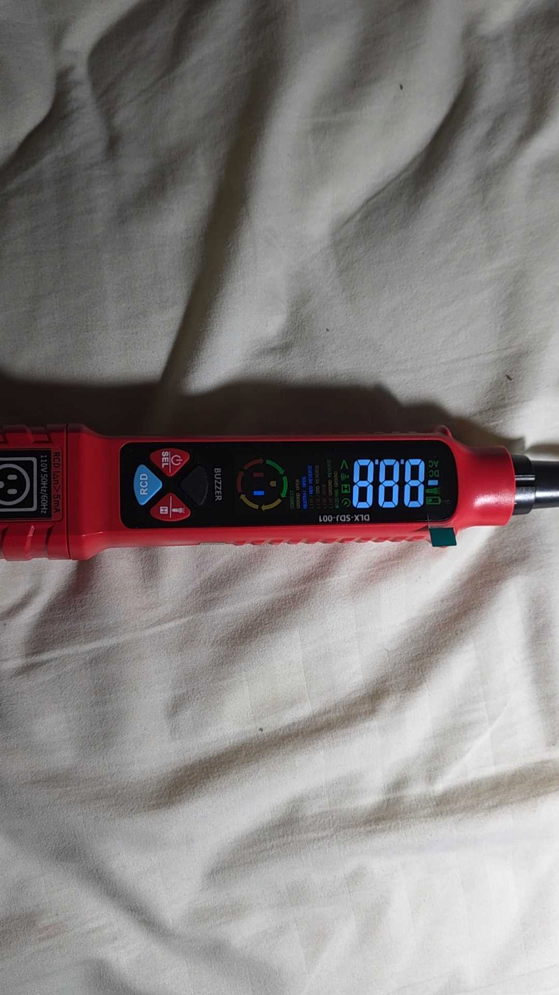 Customer photo of outlet circuit and voltage tester pen in use