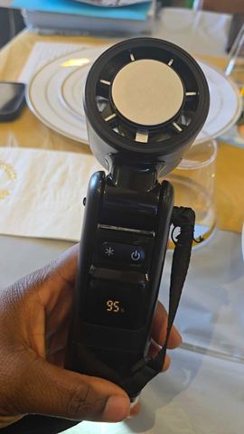 Customer photo for BOGO Handheld Cooling Fan, 5-Speed 4000mAh Rechargeable