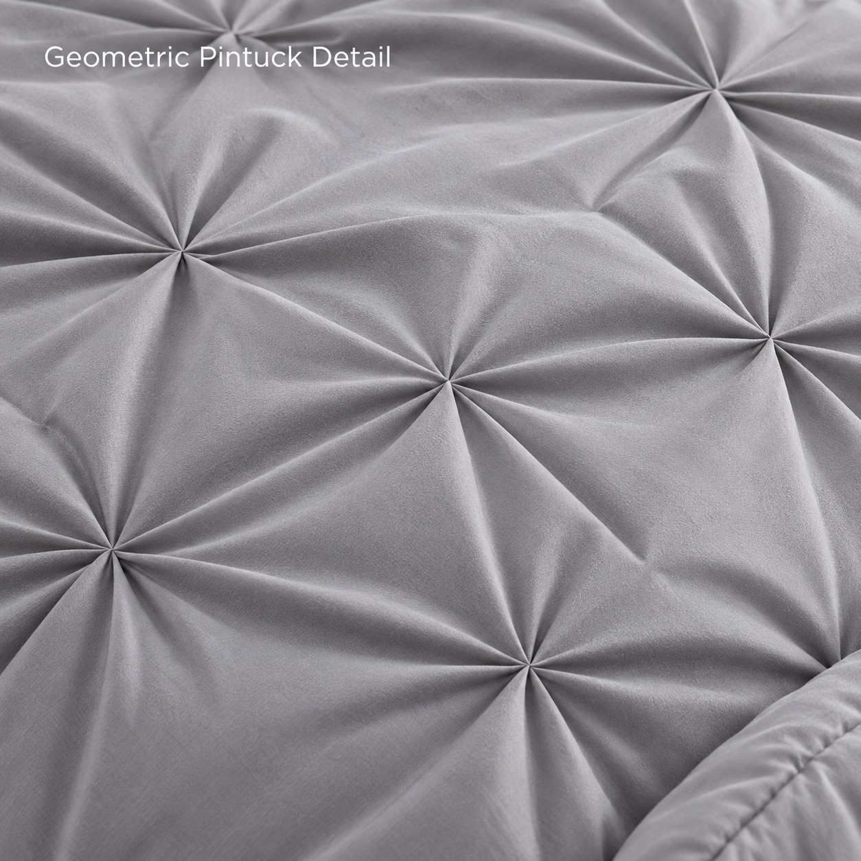close view of geometric gathered center pintuck detail on brushed microfiber