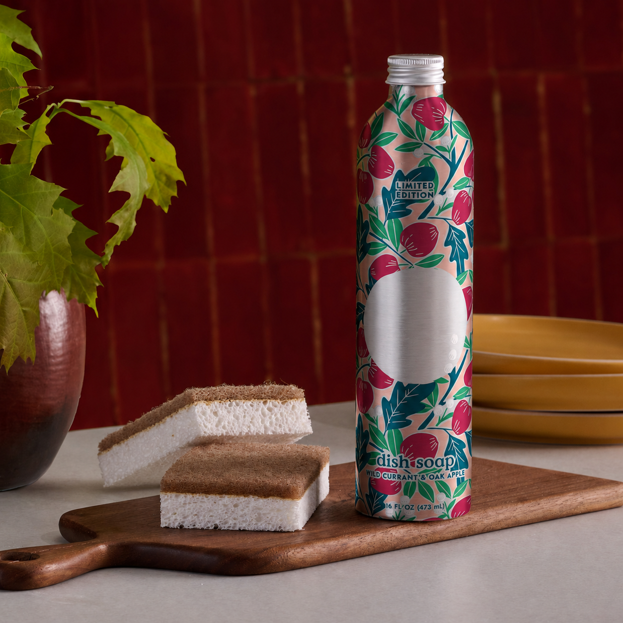 dish soap refill bottle on kitchen counter with sponge and dishes