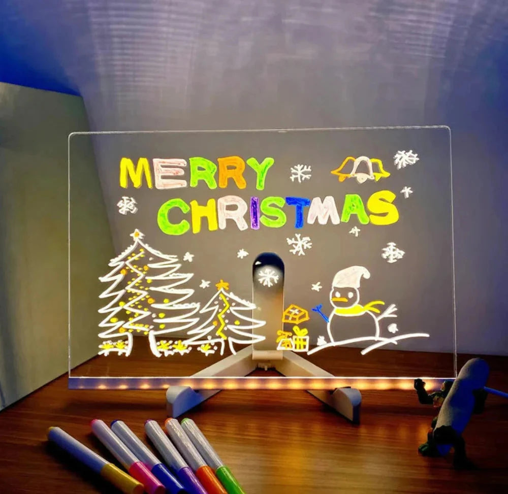 LED drawing board for kids glowing with a hand-drawn Christmas scene
