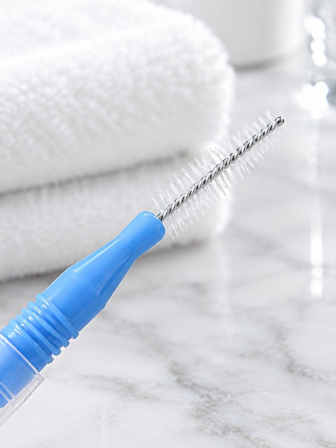 Interdental brush with soft bristles for cleaning between teeth