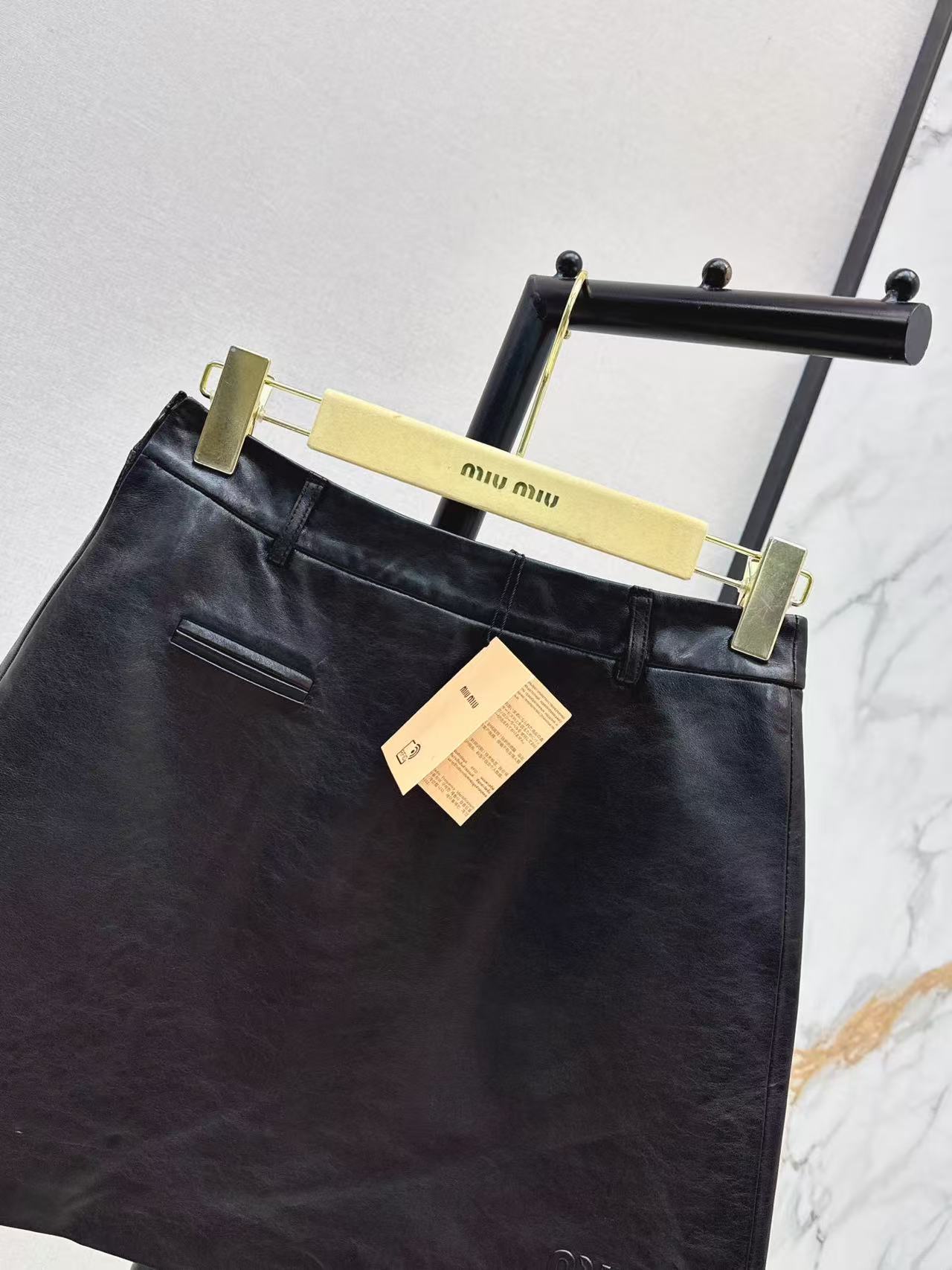 M series Pocket Detail Short Leather Mini Skirt